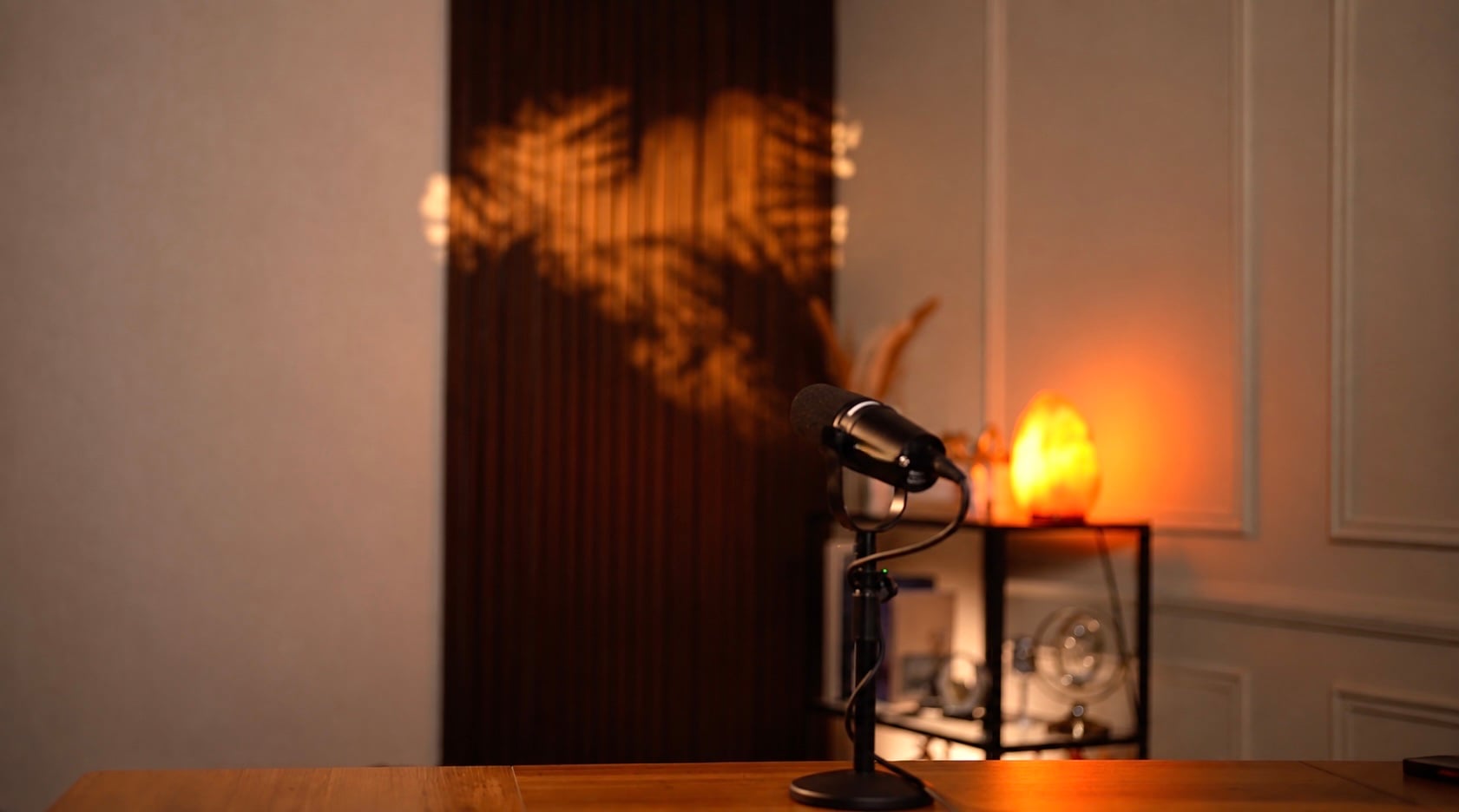 Moody solo podcast set with patterned backlight and salt lamp — Podflix Studio Dubai